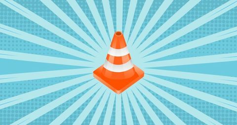 Vibrant Traffic Cone on Radiant Blue Background