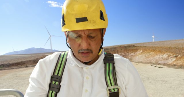 Construction Worker Wearing Safety Gear at Wind Farm Renewable Energy Site - Download Free Stock Images Pikwizard.com