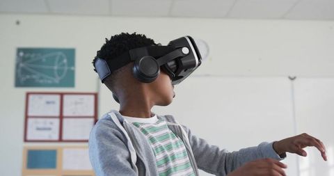 Youth Student Experiencing Virtual Reality in Classroom Wearing Headset and Headphones