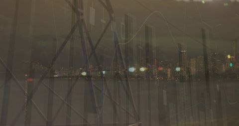 Digital Financial Data Visualization Over Cityscape at Night