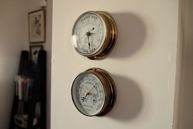 Vintage Brass Barometer and Tide Clock Mounted on Wall - Download Free Stock Photos Pikwizard.com