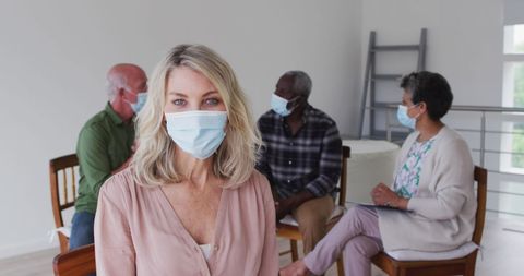 Diverse Group in Masks Discussing in Home Environment
