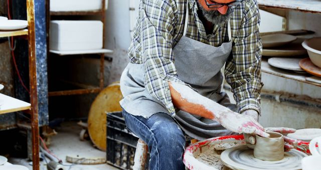 Senior Male Artisan Creating Pottery on Wheel in Studio - Download Free Stock Images Pikwizard.com