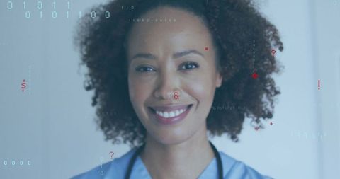 Smiling clinician wearing blue scrubs and stethoscope with futuristic digital data overlay