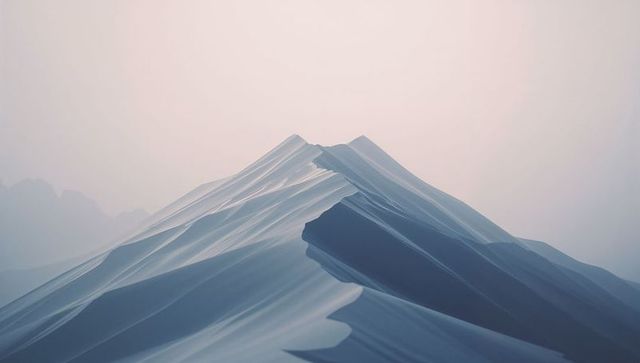 Dramatic alpine peaks with jagged ridges in misty light