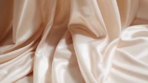 Champagne Silk Flowing in Slow-Motion Video Clip, Shimmering Folds and Soft Sheen