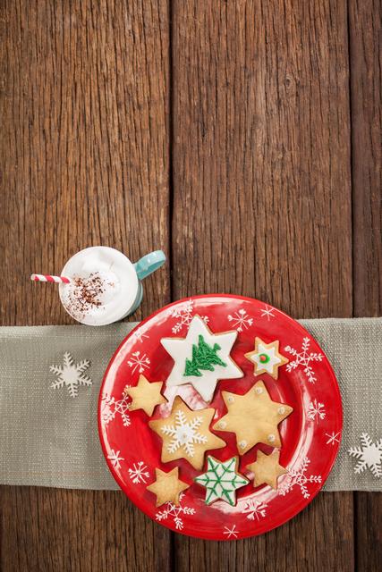 Sweet food and cappuccino decorated on wooden table during christmas time