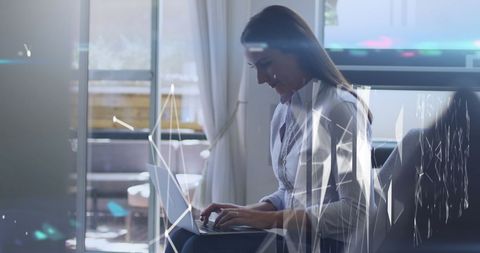 Businesswoman Typing in Modern Office with Digital Effects