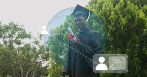 Holding diploma and wearing cap and gown with digital globe overlay on campus green