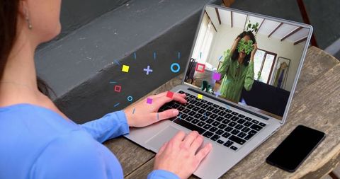 Virtual meeting on laptop with graphic overlay animation