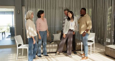 Therapist Embracing Group Members After Session