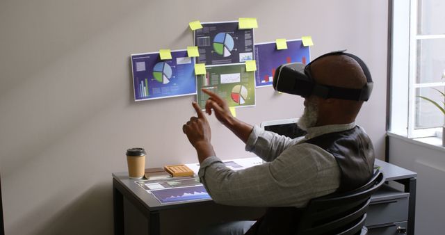 Businessman Analyzing Data with Virtual Reality Headset and Interactive Charts - Download Free Stock Images Pikwizard.com