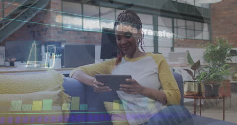 Businesswoman Engaging with Tablet and Data Graphics