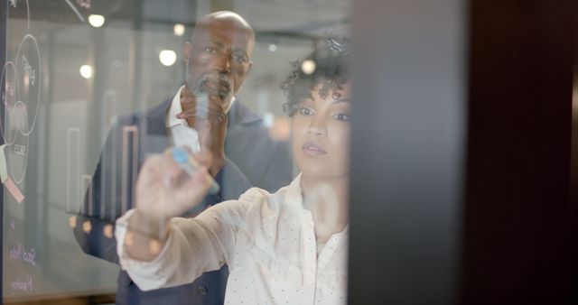 Business Team Analyzing Data on Transparent Board - Download Free Stock Images Pikwizard.com