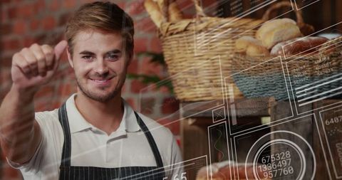 Smiling Baker Giving Thumbs Up in Modern Bakery with Digital Overlays