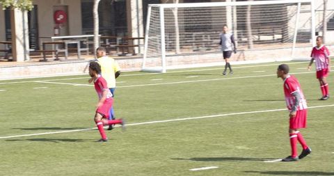 Youth Soccer Game Action on Sunny Day