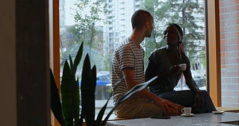 Diverse Friends Sharing Coffee in Cozy Cafe Atmosphere