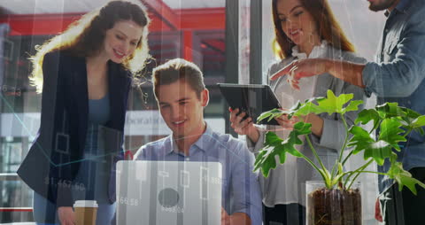 Team Collaborates on Financial Data Analysis in Modern Office