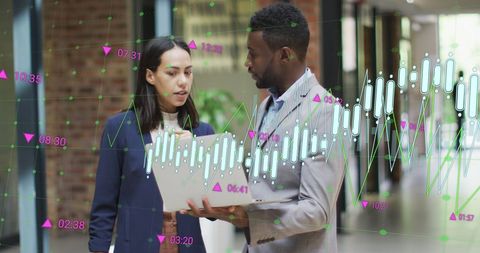 Diverse Coworkers Analyzing Digital Business Growth Data on Laptop