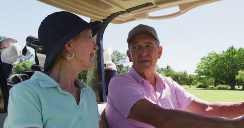 Senior Couple Enjoying Leisurely Golf Cart Ride on Sunny Course - Download Free Stock Images Pikwizard.com