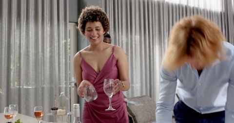 Friends celebrating and tidying after wedding reception