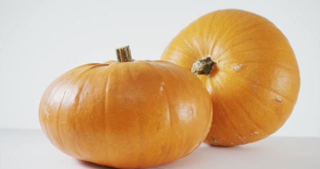 Composition of halloween orange pumpkins against white background. halloween tradition and celebration concept digitally generated image.