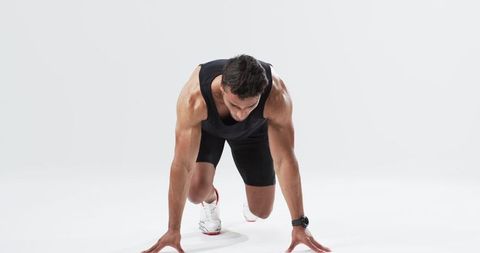 Athlete Preparing at Start Line with Determined Focus - Download Free Stock Images Pikwizard.com