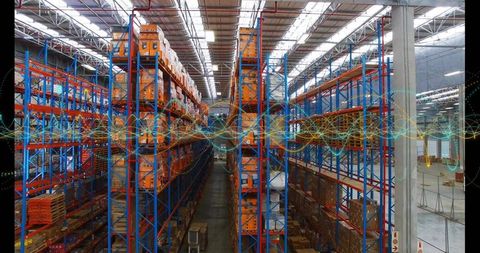 High-angle warehouse aisle with blue and orange pallet racking and waveform data overlay