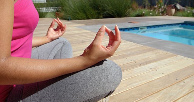Close-Up Meditating By Poolside in Relaxing Yoga Pose - Download Free Stock Images Pikwizard.com