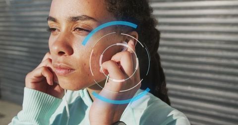 Technology Concept Overlay on Woman Using Headphones Outdoors