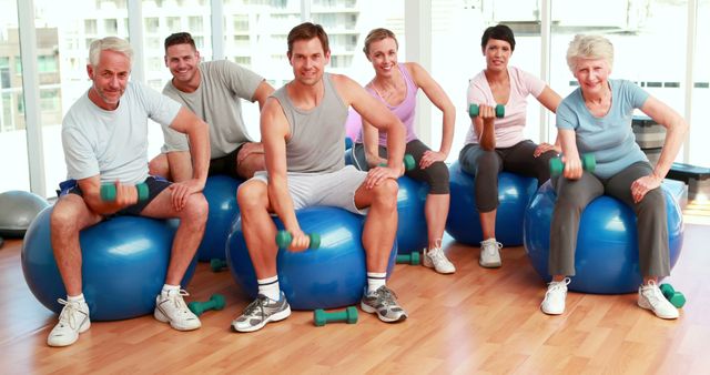 Multigenerational Group Exercising with Dumbbells on Gym Balls - Download Free Stock Images Pikwizard.com