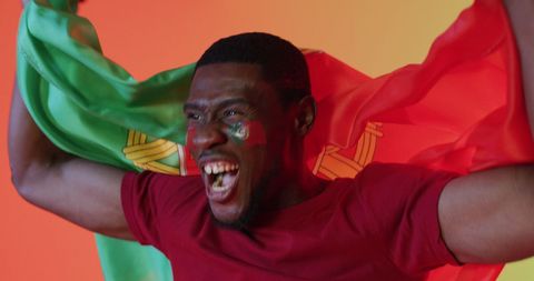 Energetic Supporter Waving Portugal Flag Celebrating Victory