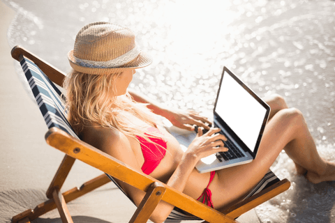 Caucasian Woman Using Laptop Sitting in Deckchair by Seashore on Transparent Background - Download Free Stock Videos Pikwizard.com