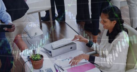 Businesswoman Analyzing Stock Market Trends at Work