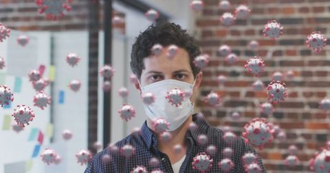 Masked Man With Digital COVID-19 Elements in Modern Office