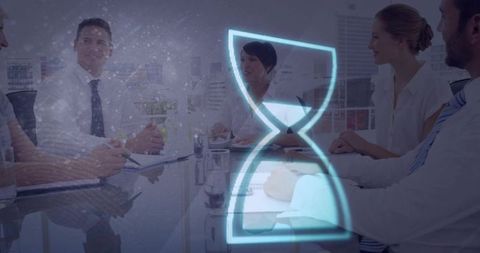Business team discussing deadline with digital hourglass hologram in modern boardroom