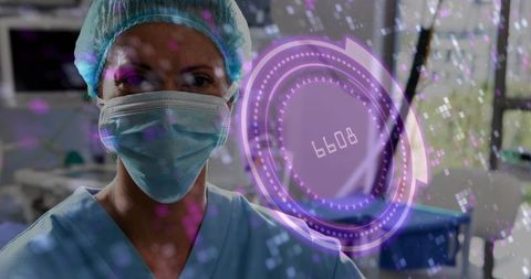 Nurse in operating room wearing mask and cap viewing holographic medical interface