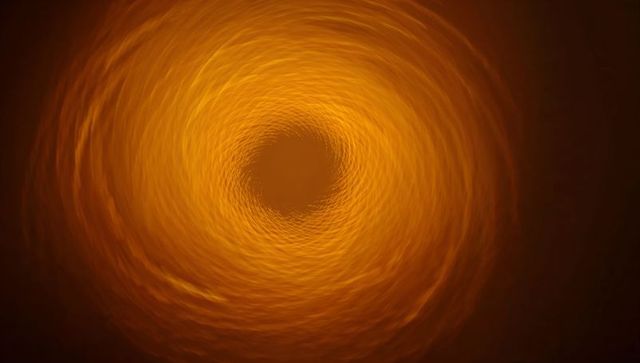 Amber vortex spiral creating hypnotic depth and motion with concentric luminous rings