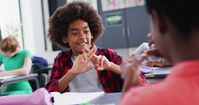 Students Communicating through Sign Language in Classroom - Download Free Stock Images Pikwizard.com