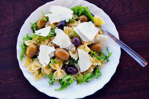 Mediterranean farfalle pasta salad with arugula, mixed olives and shaved parmesan