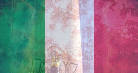 Worker in helmet on background of italian flag overlay