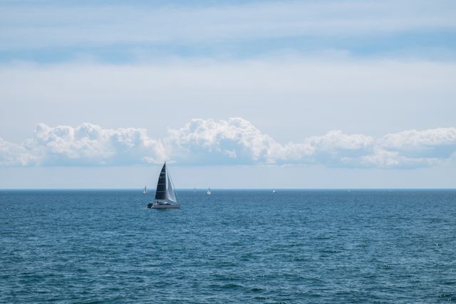 Sailboat Sailing on Sea Against Sky - Download Free Stock Photos Pikwizard.com