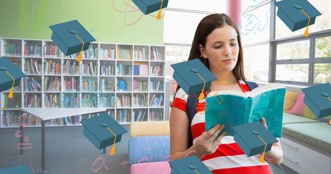 Young Woman Reading Book in Library with Graduation Caps - Download Free Stock Images Pikwizard.com