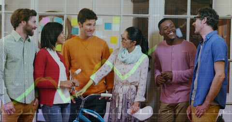 Diverse team brainstorming with digital finance overlay