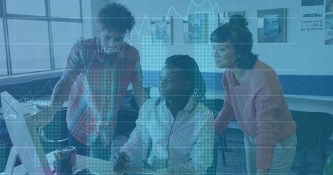 Young Professionals Analyzing Data on Monitor in Modern Workspace