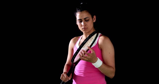 Female Tennis Player Inspecting Racket During Match - Download Free Stock Images Pikwizard.com