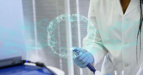 Scientist holding pipette with holographic molecular ring for clinical diagnostics