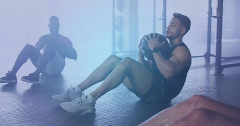 Group Fitness Training with Medicine Ball at Gym