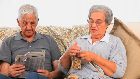 Senior Couple Enjoying Relaxed Afternoon Together on Couch