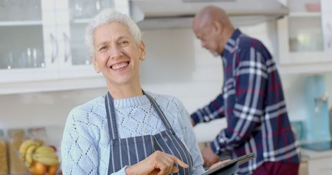 Elderly Couple Enjoying Cooking with Tablet in Modern Kitchen - Download Free Stock Images Pikwizard.com